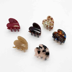 Set of 6 cute heart-shaped acetate hair claws with various marble and leopard patterns