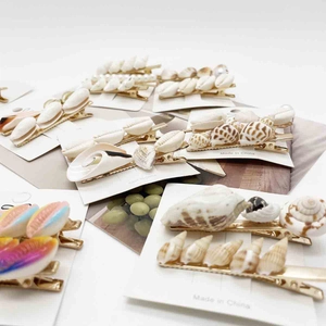 Sweet starfish and shell hair clip set in candy colors on white backing card