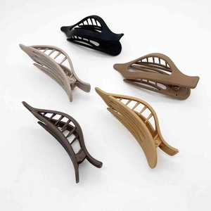 Set of 5 matte finish banana hair clips in neutral earth tones with hollow design