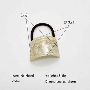 Elegant U-shaped acetate hair tie with cream marble texture for ponytail styling