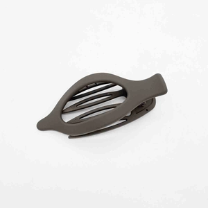 Close-up of dark brown matte hair clip with hollow teardrop design and non-slip teeth