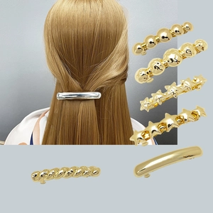 Set de pinces à cheveux en métal doré et argenté avec étoile, perle et style minimaliste