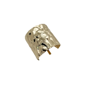 Japanese style golden metal hair cuff with hammered texture finish shown from 45-degree angle