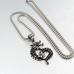 Gothic dragon pendant necklace featuring black pavé crystals and stainless steel chain