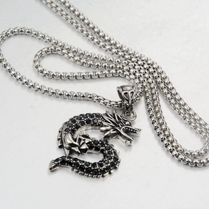 Retro dragon pendant necklace with black cubic zirconia on a silver box chain