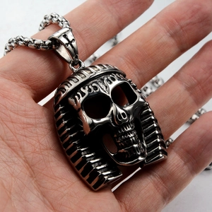 Detailed view of oxidized stainless steel pharaoh skull pendant on a link chain
