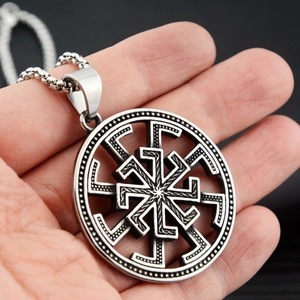 Detailed close-up of retro stainless steel eight-pointed star pendant with bead chain