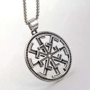 Close-up of vintage stainless steel Kolovrat sun wheel pendant with round bead chain