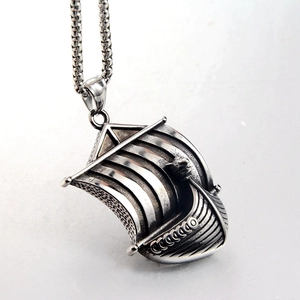Macro shot of vintage Viking longship pendant with detailed oxidized steel texture