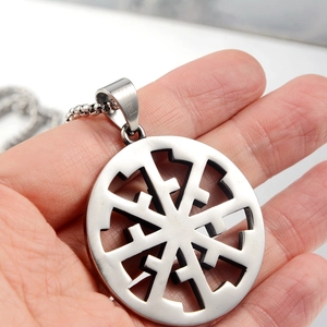Detailed view of stainless steel Slavonic Sun Wheel pendant with hollow design