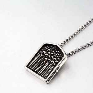 Retro stainless steel shield pendant necklace with embossed figure on a ball chain