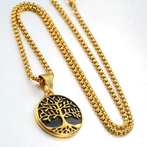 Detailed close-up of golden Tree of Life pendant with vintage black texture box chain
