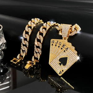 Close-up of golden iced-out hip hop necklace with royal flush poker cards pendant