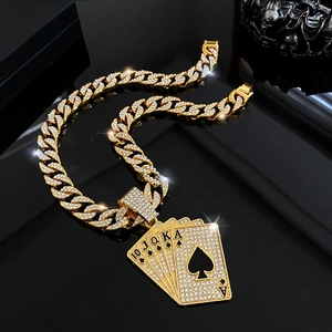 Macro view of gold iced out royal flush pendant necklace with sparkling diamonds