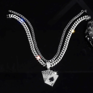 Detail of hip hop silver cuban link necklace with iced out poker cards pendant