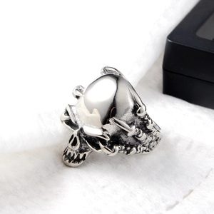 Close-up of punk style skull ring with vintage silver finish and detailed bone texture