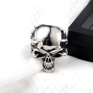 Detailed macro view of Gothic silver skull ring with intricate punk metal carvings