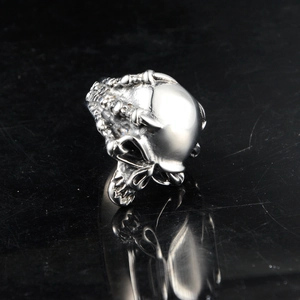 Detailed view of skull ring with polished gothic wings in hip hop motor style