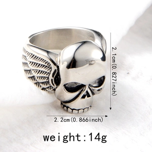 Macro detail of silver skull ring with wings showing 2.1cm height and 2.2cm width