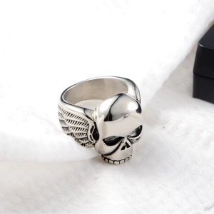 Gothic hip hop skull ring featuring detailed silver wing carvings and a punk rock design