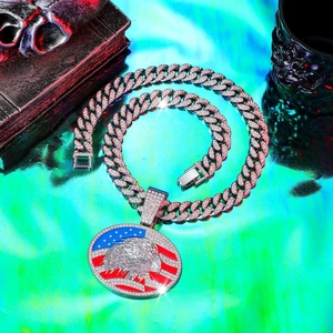 Detailed view of hip hop Cuban chain with iced-out American flag eagle pendant