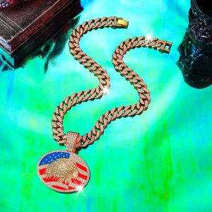 Macro shot of hip hop eagle pendant with USA flag design on iced-out cuban chain
