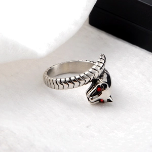 Edgy leopard head wrap ring in silver finish with striking red crystal eyes detail
