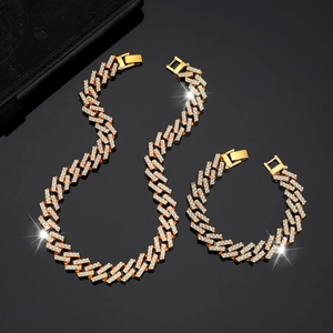 Iced out gold Cuban link chain necklace and bracelet set with sparkling rhinestones