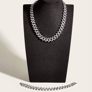 Detail of silver-plated iced out Cuban link necklace and bracelet set with rhinestones