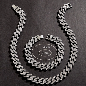 Macro shot of silver hip-hop cuban chain jewelry set with 45cm necklace and 21cm bracelet