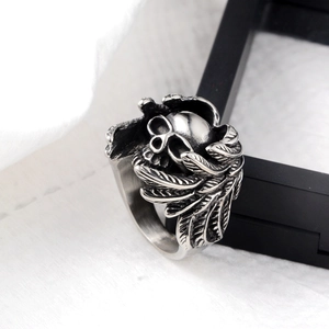 Gothic vintage silver skull ring with detailed feather wings in retro hip hop style