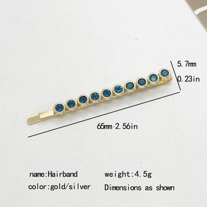 Detail view of a 65mm gold hair clip with 10 round blue rhinestones and dimensions