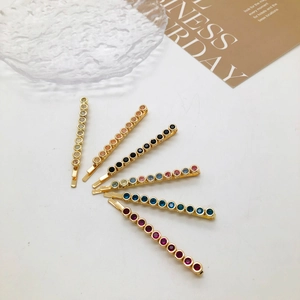 Detailed view of colorful crystal rhinestones on 6pcs golden metal hair clip set