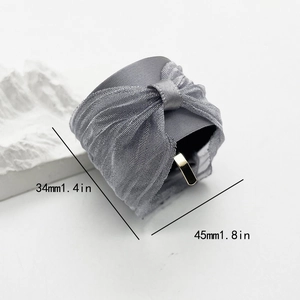 Elegant grey satin and pleated mesh bow hair clip with golden metal fastener
