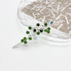 Bloemen haarklem met groene en witte strass op zilveren legering basis