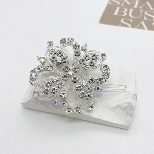 Detailed macro view of silver flower hair clip with sparkling rhinestones and AB crystals