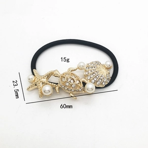 Gold starfish seashell hair tie with pearls and crystals on high elastic black band