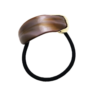Elegant acetate hair tie with brown marble resin and gold metal accent for high ponytails