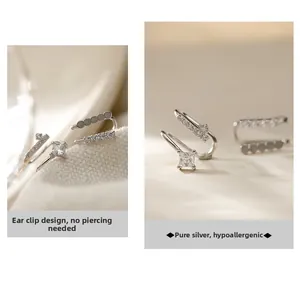 Detail view of double-layered silver ear cuffs featuring sparkling cubic zirconia stones