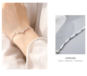 Macro detail of 925 sterling silver antler bracelet featuring a sparkling zircon stone
