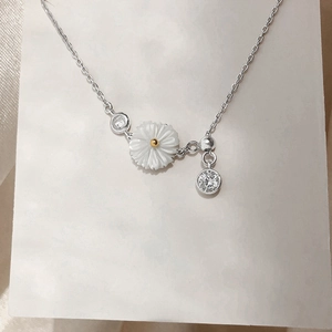 Elegant sterling silver daisy necklace with shell petals and sparkling zircon accents