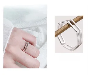 Macro detail of silver geometric double-layer octagonal ring with mirror-polished finish