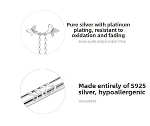 Vue détaillée du poinçon en argent sterling S925 et des boucles d'oreilles papillon