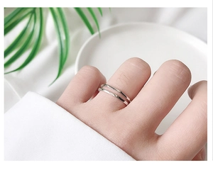 Close-up of minimalist 925 sterling silver double-layered irregular geometric open ring
