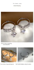 Macro detail of S925 sterling silver hoop earrings with micro-inlaid zircon stones