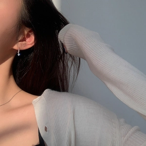 Elegant s925 silver stud earrings with sparkling zircon crystals on female model