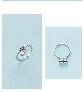 Detailed close-up of s925 silver adjustable ring with cute dangling bell charms