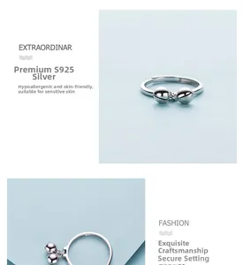 Macro detail of S925 sterling silver adjustable ring with polished ball charms
