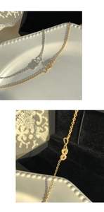 Détail du pendentif infini avec sertissage micro-pavé en finitions or et argent