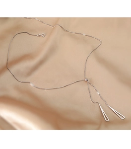 Detail of adjustable S925 silver lariat necklace with geometric triangle charms on silk